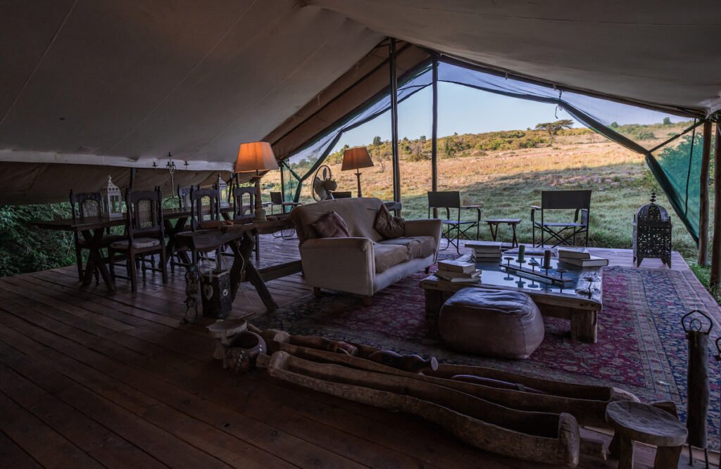 Speke's Camp canvas lounge and dining area opening onto the surrounding landscape