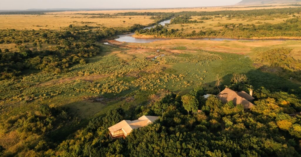 Tangulia Mara Camp guest areas and tents beside the open salt-lick landscape