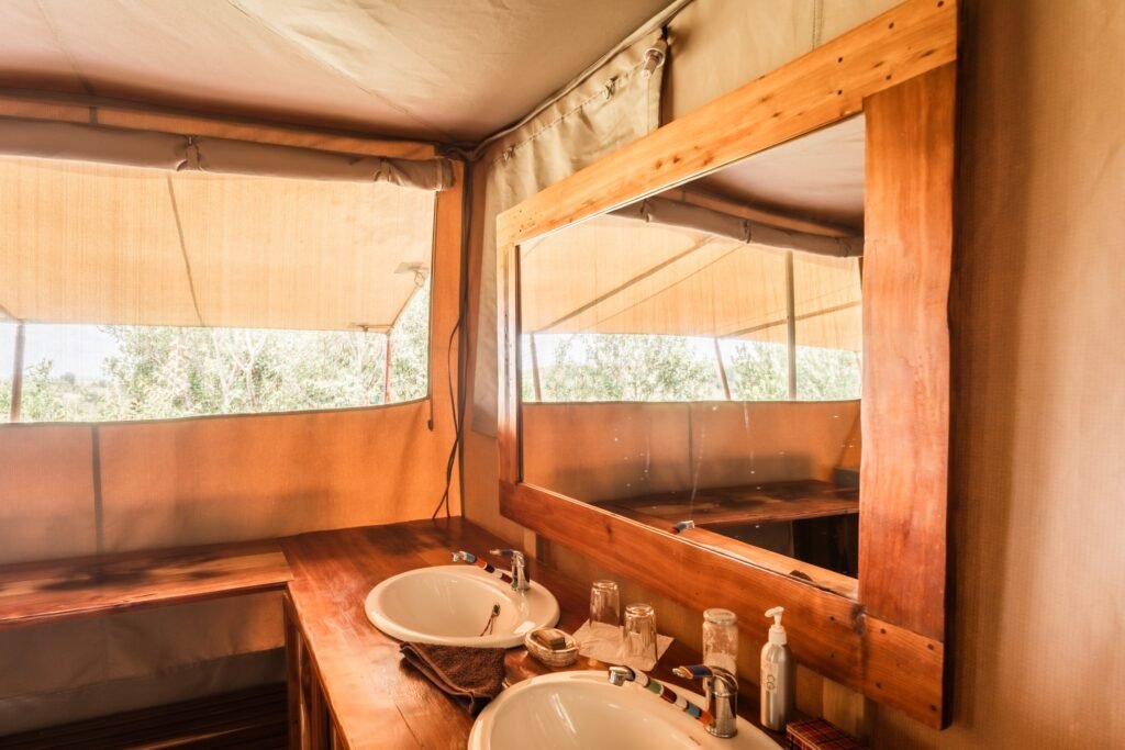 Tangulia Mara Camp tent bathroom basin and mirror with canvas windows
