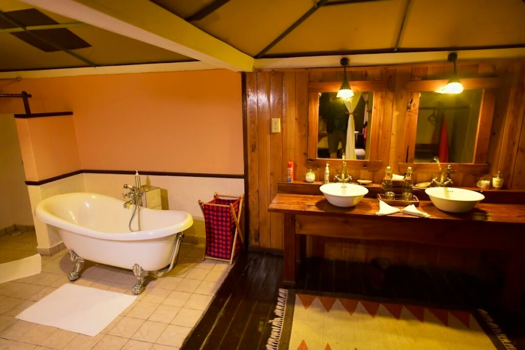 Tipilikwani Mara Camp family bathroom with freestanding bath and twin basins