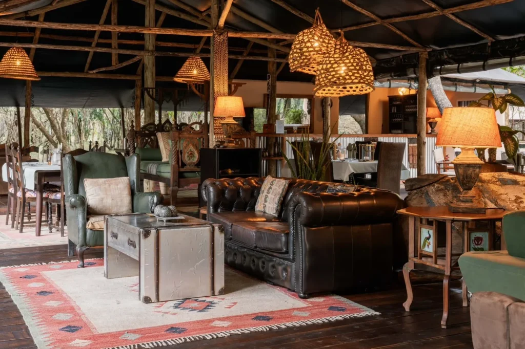 Tor's Camp open-sided mess tent with leather seating and dining tables