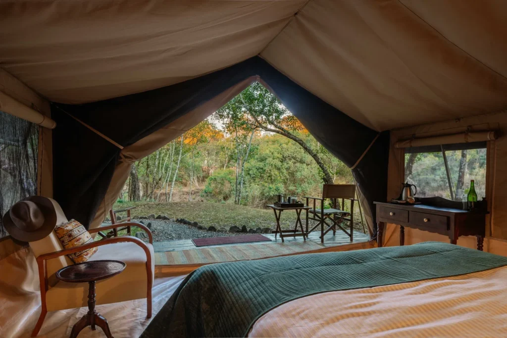 Tor's Camp Mtoni tent bedroom opening onto a furnished private veranda