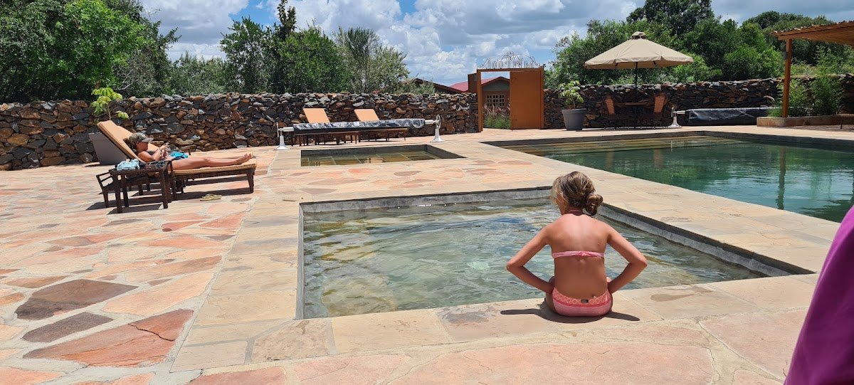 Mara West Camp main swimming pool with two smaller basins and stone terrace